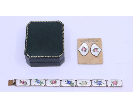 A Norwegian early 20th century enamel and silver gilt bracelet, comprising rectangular panel links, each decorated with guill