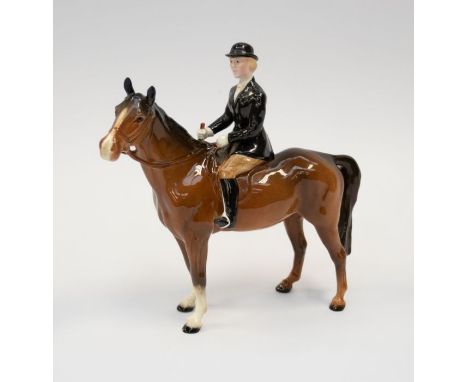 A Beswick female rider with a chestnut horse small chip to front hoof