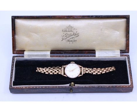 Omega- a ladies vintage 9ct gold Omega wristwatch, comprising a round silvered dial with applied gilt arrow and number marker