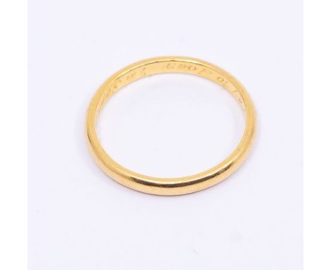 A 22ct gold band, width approx 2mm, size R, weight approx 3.4gms 