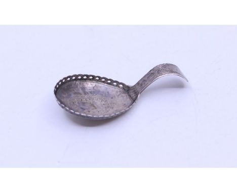 A George III silver caddy spoon with bright cut engraved decoration and pierced work to the rim of the bowl, vacant cartouche