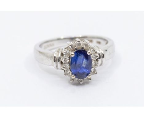 A sapphire and diamond 18ct white gold ring by Iliana, comprising a claw set oval cut sapphire to the centre approx 7 x 5mm, 