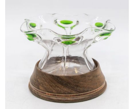 Stuart glass: A Peacock trailed clear glass bowl with green colourway to peacock design. Standing on wooden base.Size: Approx