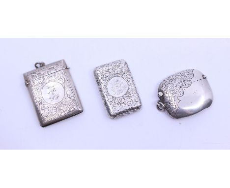 A late Victorian silver vesta case, profuse scrolling foliate decoration, engraved monogram to centre, hallmarked by Sampson 