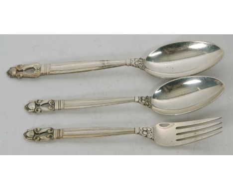 A George Jenson sterling acorn pattern dessert fork and spoon, together with a serving spoon in the same pattern, 150gms