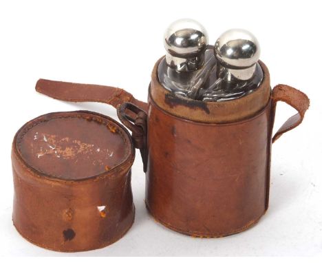 A vintage leather travel case double glass spirit flask, both with screw on metal bulbous lids, the bottles are 12cm tall (a/