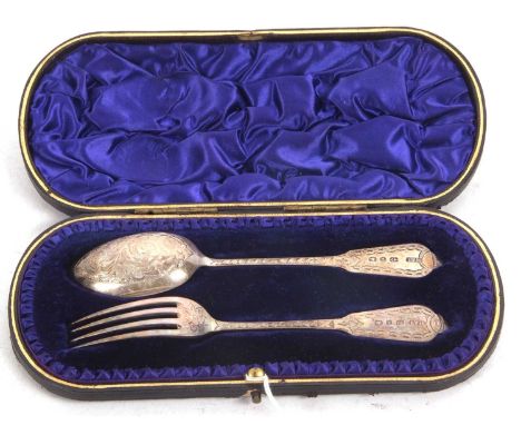 A late Victorian silver christening spoon and fork, chased and engraved all over, hallmarked for Birmingham 1899, makers mark