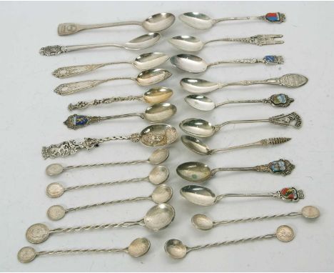 A quantity of white metal souvenir teaspoons, six with enamel detail, ten various souvenir spoons, various other souvenir spo