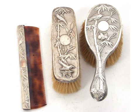 A Chinese silver circa 1900 backed hairbrush, clothes brush and comb, decorated with birds and bamboo by Hung Chong &amp; Co,