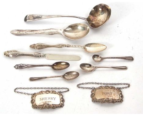 Mixed lot, Two hallmarked silver spirit labels, a George lll sauce ladle London 1799, Thomas Wallis ll, an ornate white metal