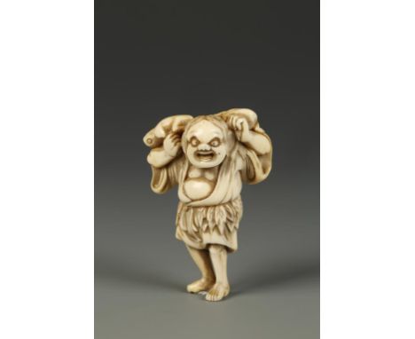 A JAPANESE IVORY NETSUKE OF GAMASENNIN, the portly figure holding two frogs on his shoulders, circa 1800, 2.5" high