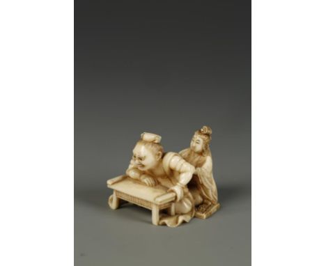 A JAPANESE IVORY FIGURE GROUP NETSUKE finely carved with a woman applying moxa to a man's back, signed Eishin, circa 1890, 1.