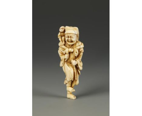 A JAPANESE IVORY SARUMAWASHI NETSUKE, the figure standing on one foot and laughing while a monkey with a serious expression s