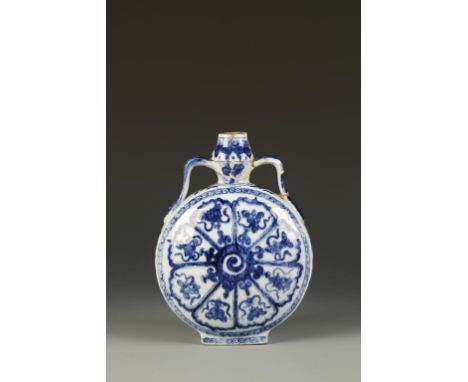 A CHINESE BLUE AND WHITE MOON FLASK, each side decorated with a central spiral motif surrounded by eight tapering ogee panels