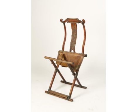 A CHINESE FOLDING CHAIR, the scroll top above a relief-carved splat and leather seat, Qing, 18th/19th century, 46" long when 