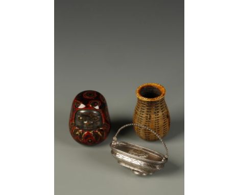 THREE JAPANESE NETSUKE including one in stag antler in the form of a basket, 1.5" high; a silver example also of basket form,