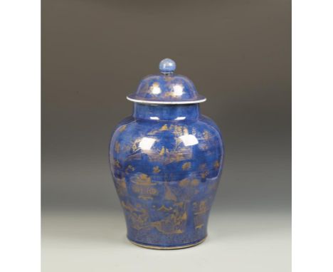 A LARGE CHINESE POWDER BLUE AND GILT COVERED JAR of baluster form, decorated with petal-shaped panels of flowers and landscap