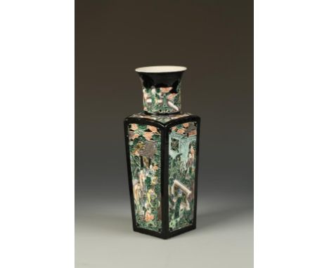 A CHINESE FAMILLE NOIRE SQUARE VASE of slightly tapering form, each side with relief pierced decoration of figures beside pav