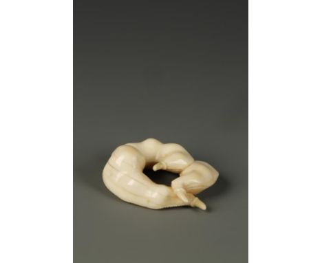 A JAPANESE IVORY NETSUKE in the manner of Kiyokatsu, showing a cluster of three bean pods, unsigned, circa 1850, 1.75" long