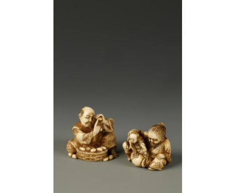 TWO JAPANESE FIGURAL OKIMONO NETSUKE, one showing a man seated with two boys, signed Mitsumasa, circa 1900, 1.75" long; the o