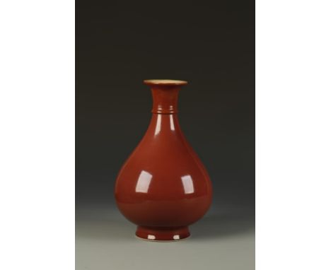 A CHINESE COPPER-RED PEAR-SHAPED VASE, the gently rounded body evenly covered in a rich glaze of crushed-raspberry tone pooli