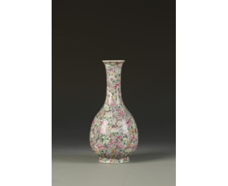 A CHINESE FAMILLE ROSE 'MILLEFIORE' VASE of bottle form, densely decorated in polychrome with flowers, the base with a Kangxi