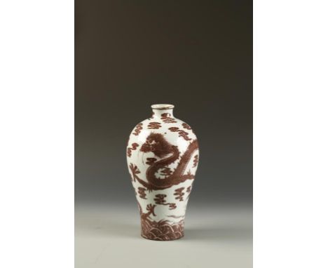 A RARE CHINESE UNDERGLAZE-RED MEIPING 'DRAGON' VASE, the upper ovoid body decorated with a ferocious five-clawed dragon among
