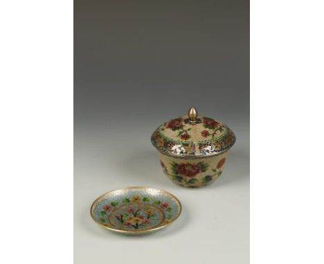 A CHINESE PLIQUE-A-JOUR COVERED BOWL AND SAUCER, the bowl decorated with flowers on a scale ground, 5" dia.; the associated s