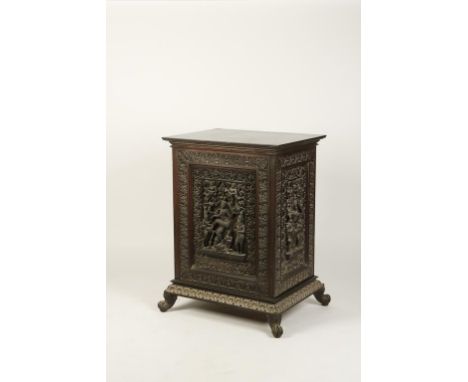 AN UNUSUAL ANGLO-INDIAN FREESTANDING PEDESTAL CABINET, each side carved in high relief with Hindu deities bordered with scrol