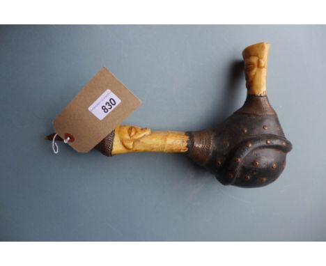 An unusual ethnic pipe formed of bones 