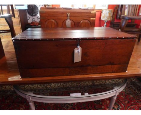A mahogany studded trunk with hinged lid with twin metal handles