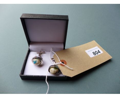 A pair of boxed cufflinks with revolving gemstone globes inset