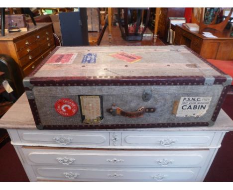 A vintage carved cabin trunk and another 