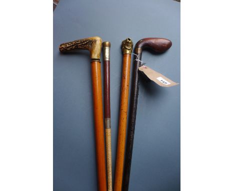 A sword stick, Malacca cane, 19th century gun cane and riding crop  