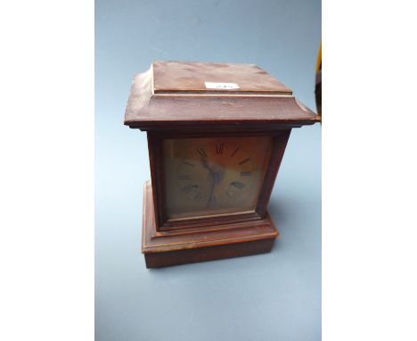 An oak cased mantel clock 