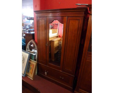 A Victorian mahogany wardrobe with central mirrored door over single drawer raised on plinth base 127cm wide 