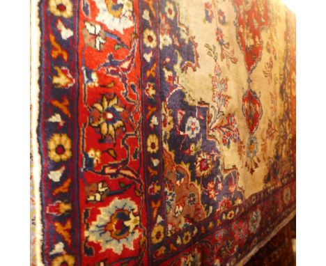 An extremely fine carpet Persian Sarouk rug, 200cm x 135cm, central double pendent medallion with repeating petal motifs on a