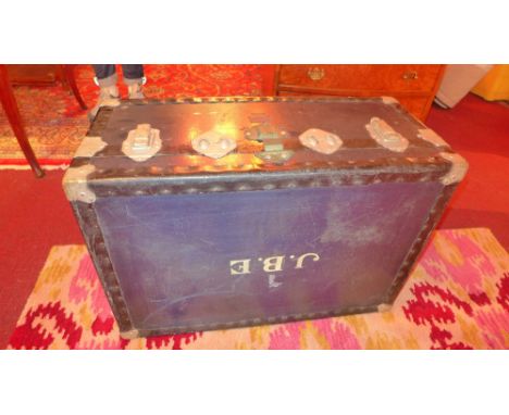 A vintage 'Watajoy' London made navy blue trunk, marked J.B.E to the top 