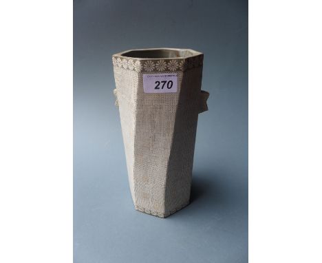 A Korean ceramic vase of twisted septagonal form with floral designs 