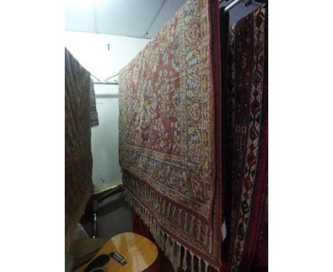 A collection of four vintage rugs 