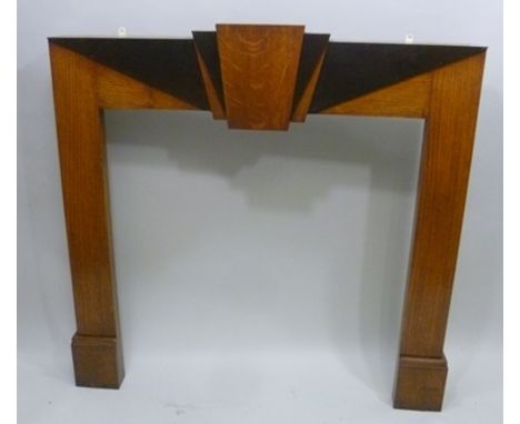 AN ART DECO OAK AND STAINED WOOD MANTEL SURROUND having classic keystone design top, 1930's, 128cm wide x 127cm high 