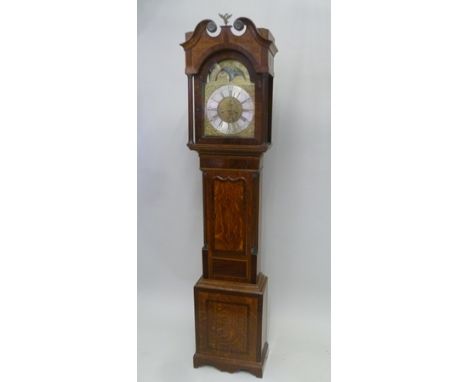 AN OAK LONGCASE CLOCK the dial engraved Wilkinson of Wigton, the hood with swan neck pediment and fluted columns, the case wi