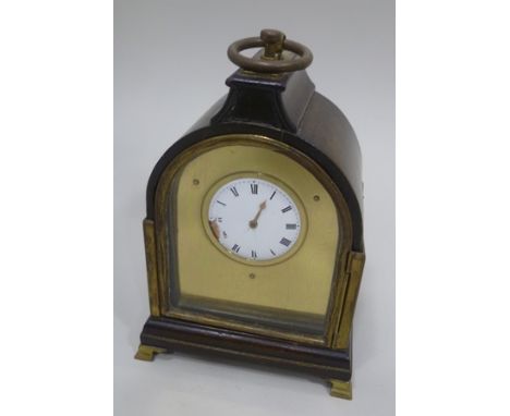 A 19TH CENTURY MAHOGANY CASED TABLE CLOCK having brass ring handle raised on brass bracket feet, white enamel dial with Roman