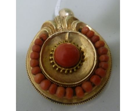 A VICTORIAN GOLD (tests 18ct) BROOCH PENDANT set with coral, having wire surround 