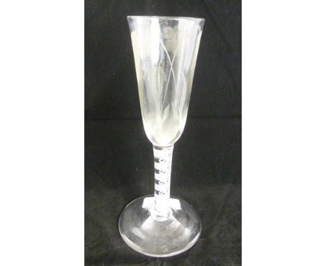 A GEORGE III ALE GLASS the fluted bowl being engraved with hop and barley decoration, cotton twist stem with central spiral s
