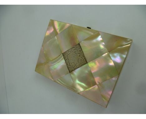 A 19TH CENTURY MOTHER-OF-PEARL CALLING CARD, having inset silver panel with bright cut floral decoration and monogram, opens 