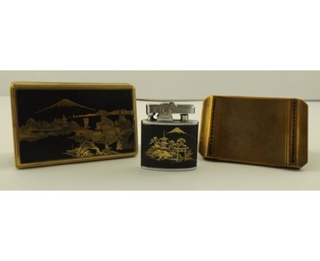 TWO MID 20TH CENTURY GILT METAL POWDER COMPACTS, one by Stratton with engine turned exterior, the other Clover with Mount Fuj