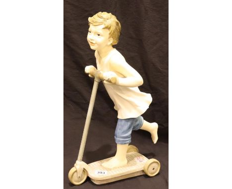 Composite vintage style boy riding scooter, H: 54 cm. P&amp;P Group 3 (£25+VAT for the first lot and £5+VAT for subsequent lo