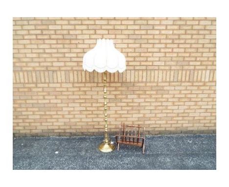 A brass standard lamp 140 cm height (to top of light fitting) and a wooden magazine rack. [2]