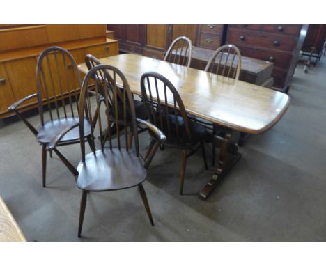 An Ercol Golden Dawn elm and beech refectory table and six Quaker chairs 